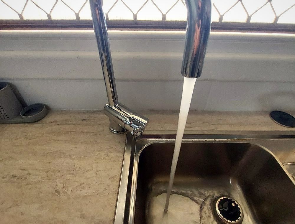 Running tap after a plumbing repair by BPG Brown's